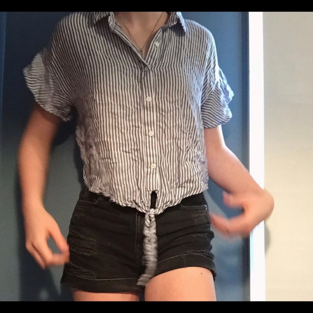 Blue and white button up cropped collared t shirt.